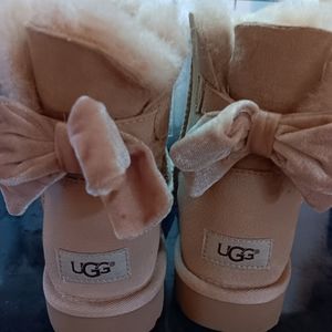 Uggs driftwood boots with bows.